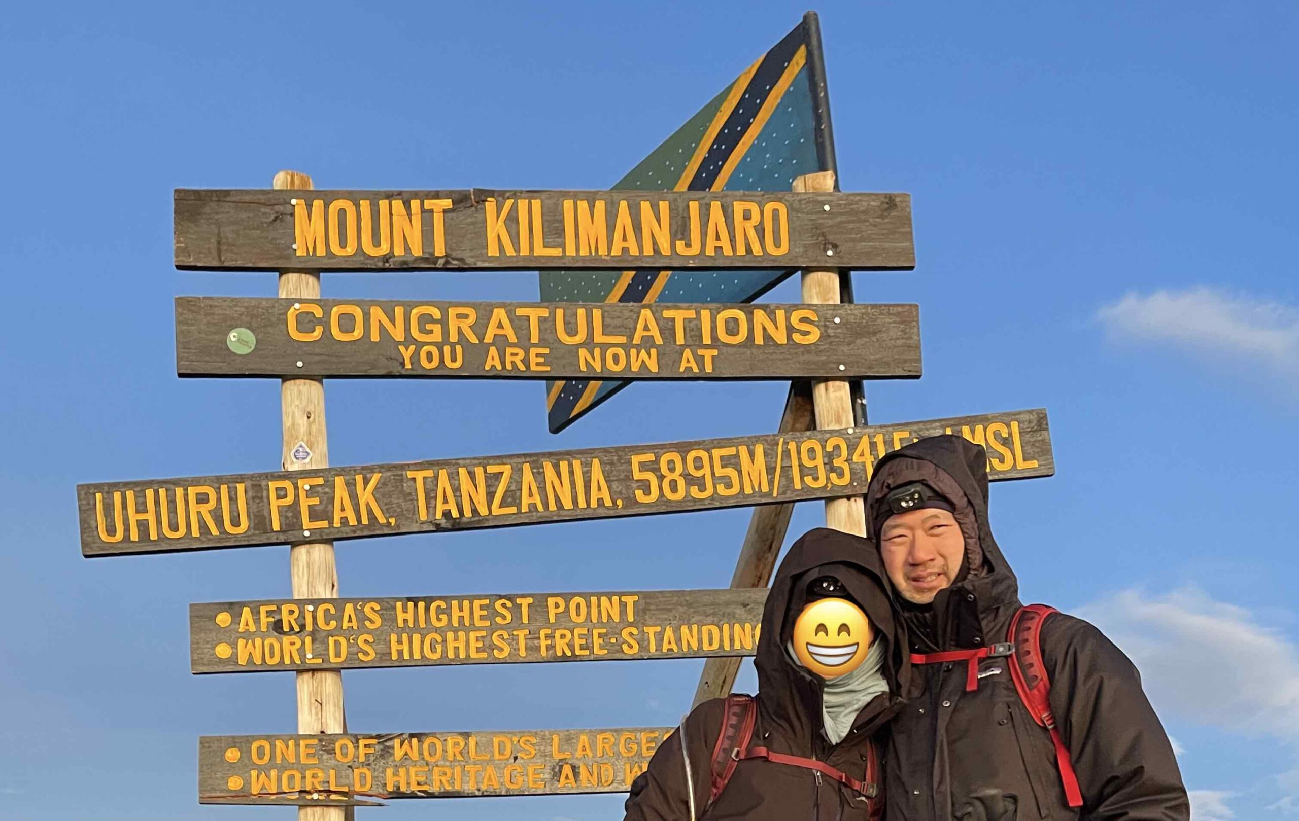 Peter Kim at the summit of Mount Kilimanjaro